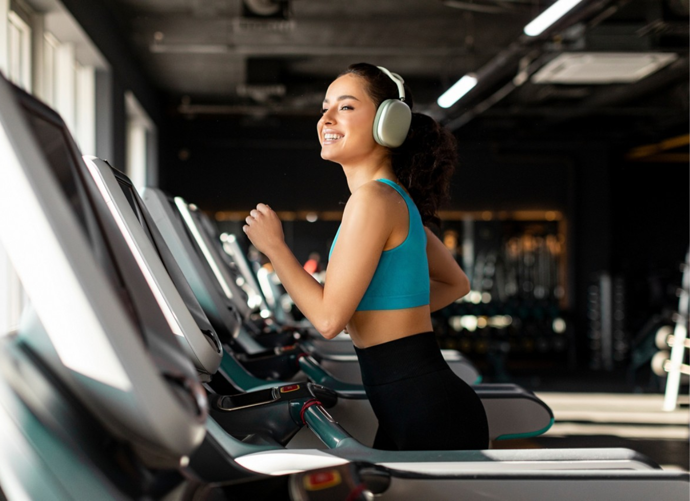 The District at Flagler Village - Ft. Lauderdale - woman in the gym with headphones